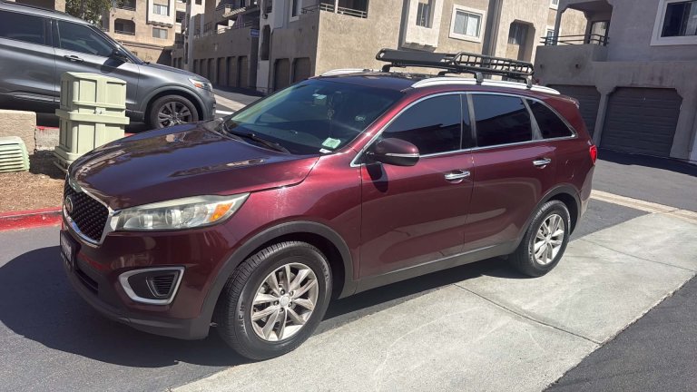High-mileage 2017 Kia Sorento in a parking lot
