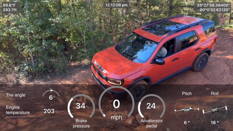 Honda Passport shown driving off-road with the HTX app.