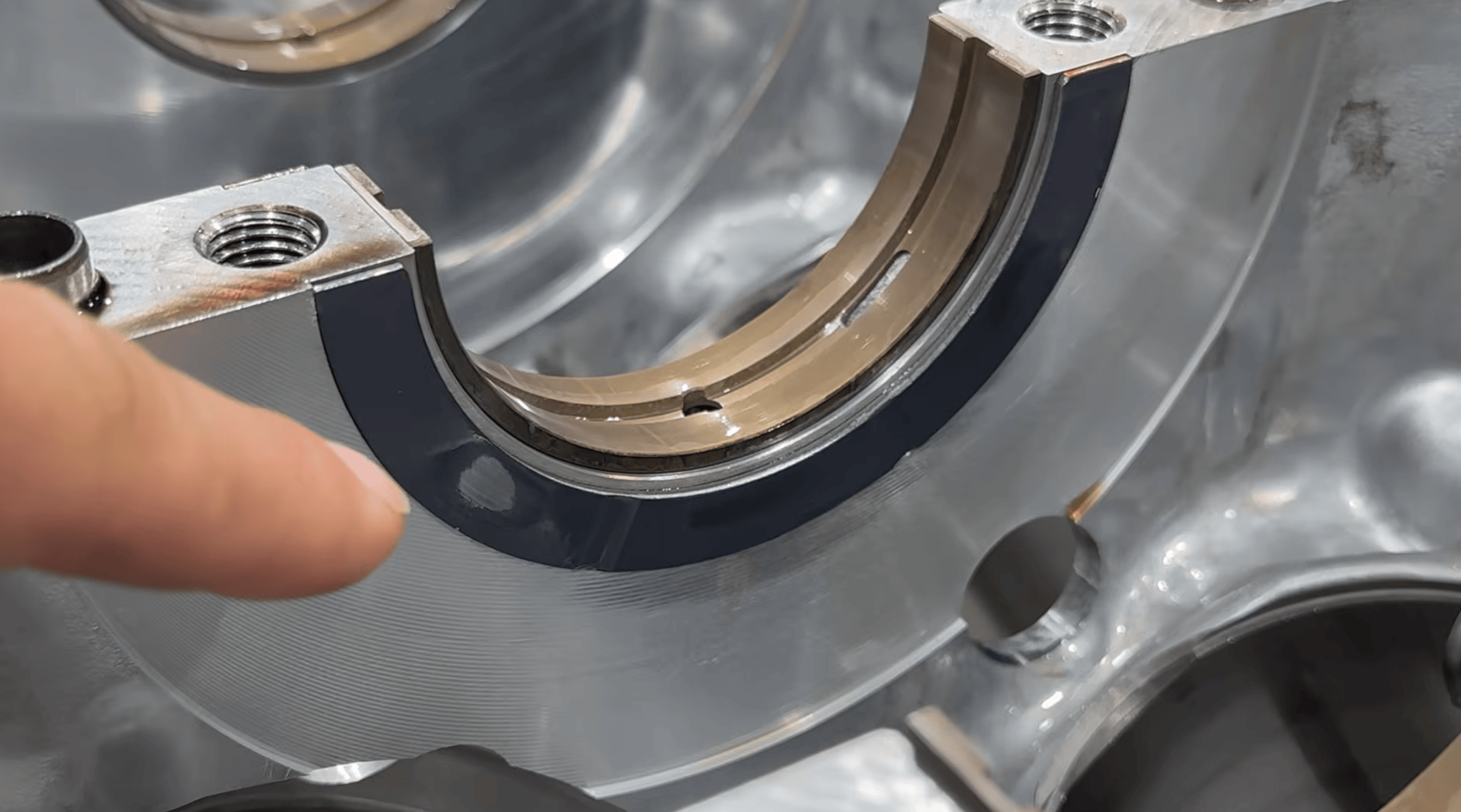Uneven wear visible on the thrust bearing of a Toyota V35A V6.