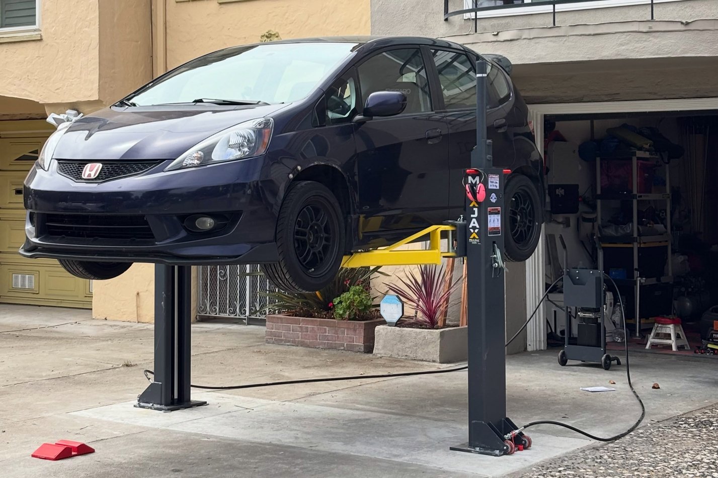 Honda Fit on home garage MaxJax setup