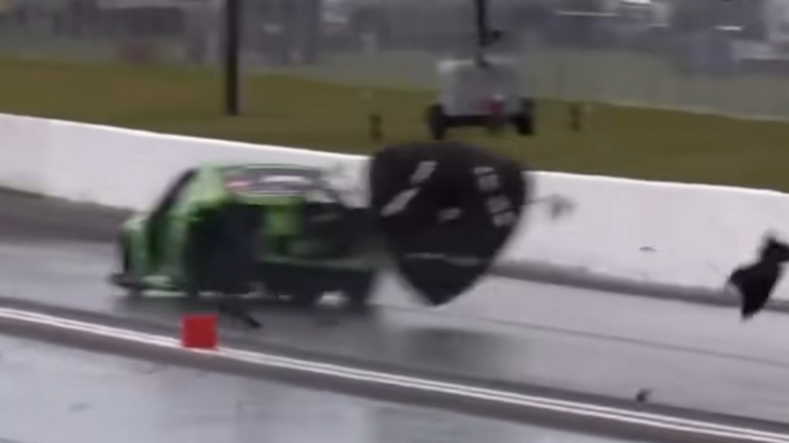 The Snot Rocket Mustang's left rear tire explodes after being struck by debris at Bradenton Motorsports Park.