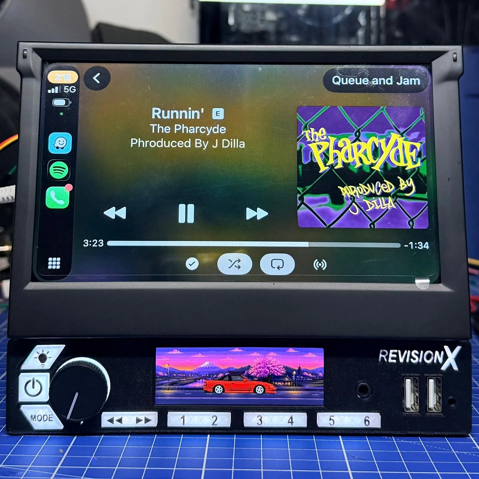 RevisionX double-DIN head unit with foldaway Apple CarPlay screen