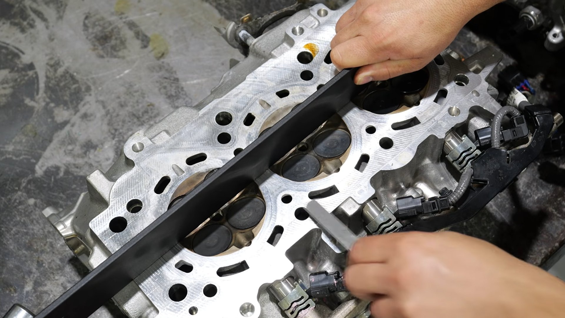 A Toyota V35A V6 being tested for a warped head.