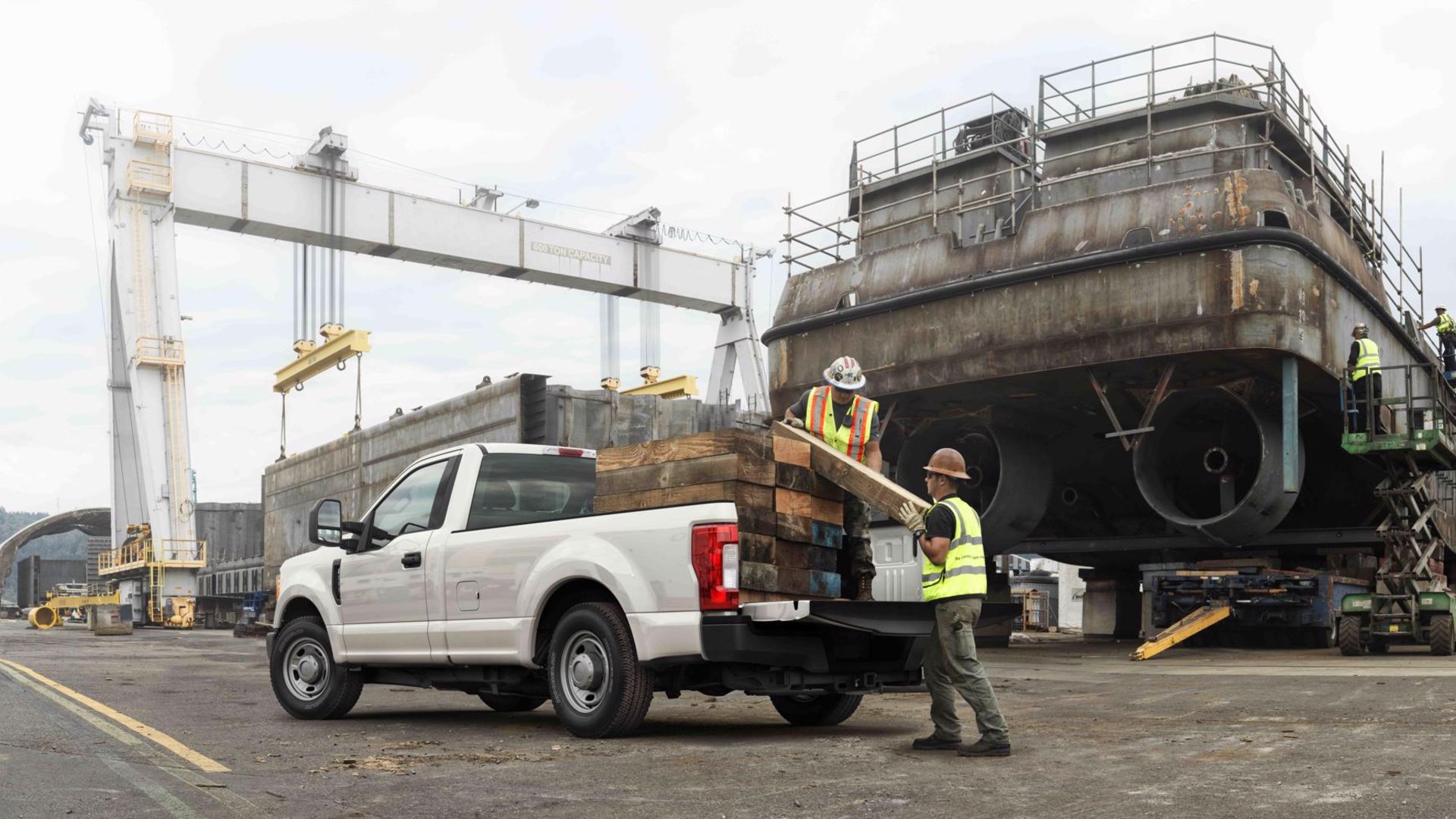 Loading timbers into back of a truck