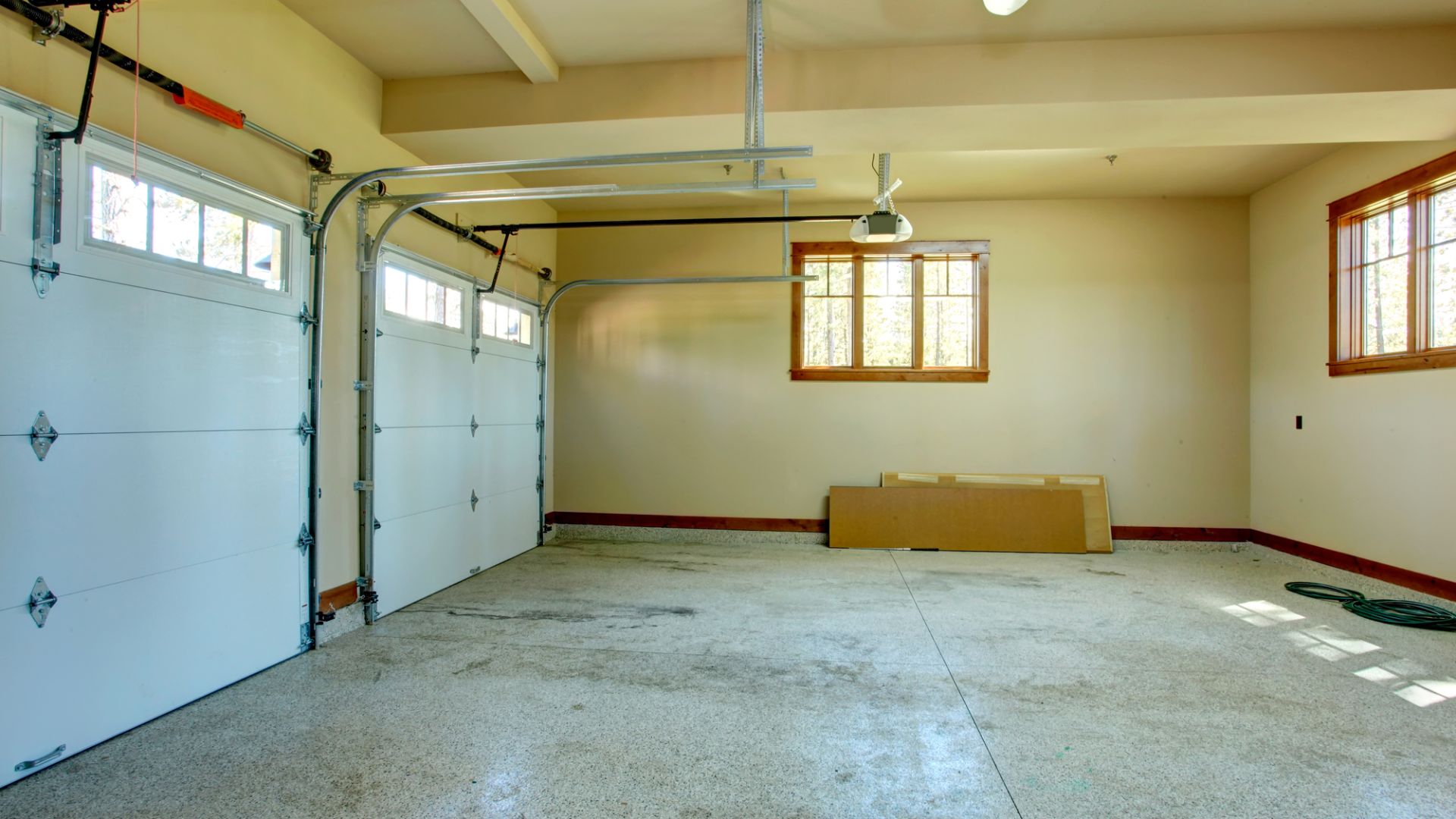 The inside of the garage door, including the torsion springs at the top left corner.