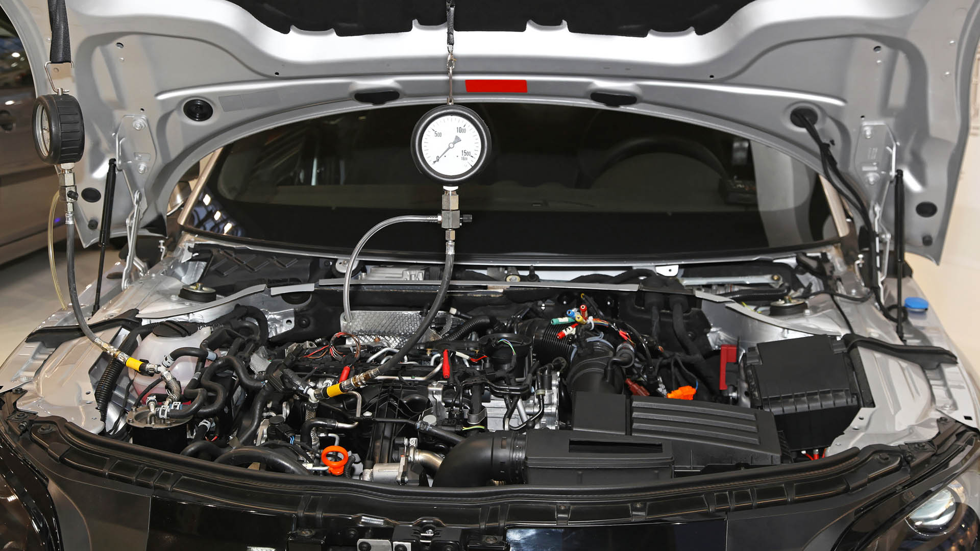 A compression tester is needed to check an engine's compression.