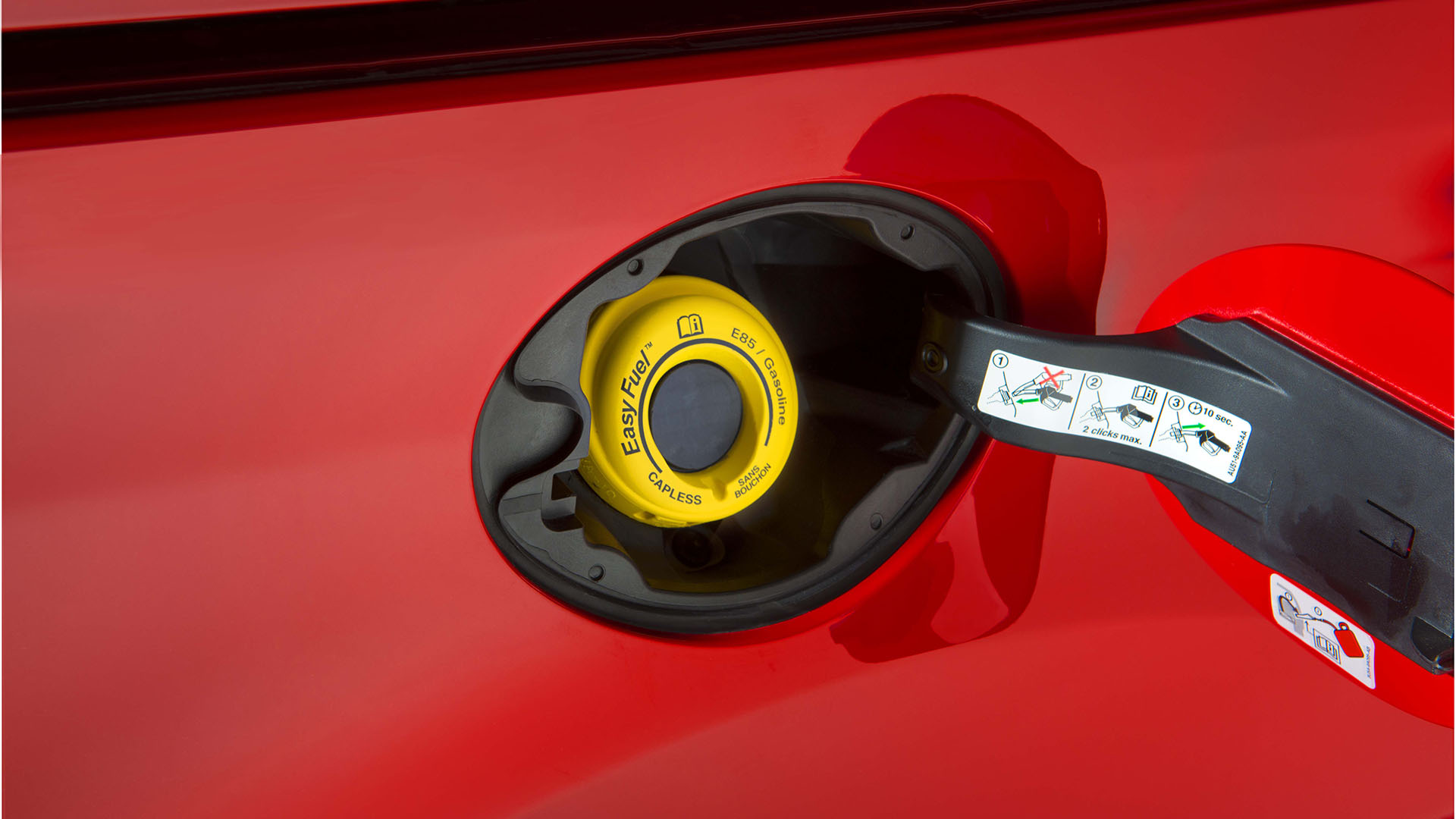 A 2016 Ford Transit Connect with a yellow E85 fuel label.