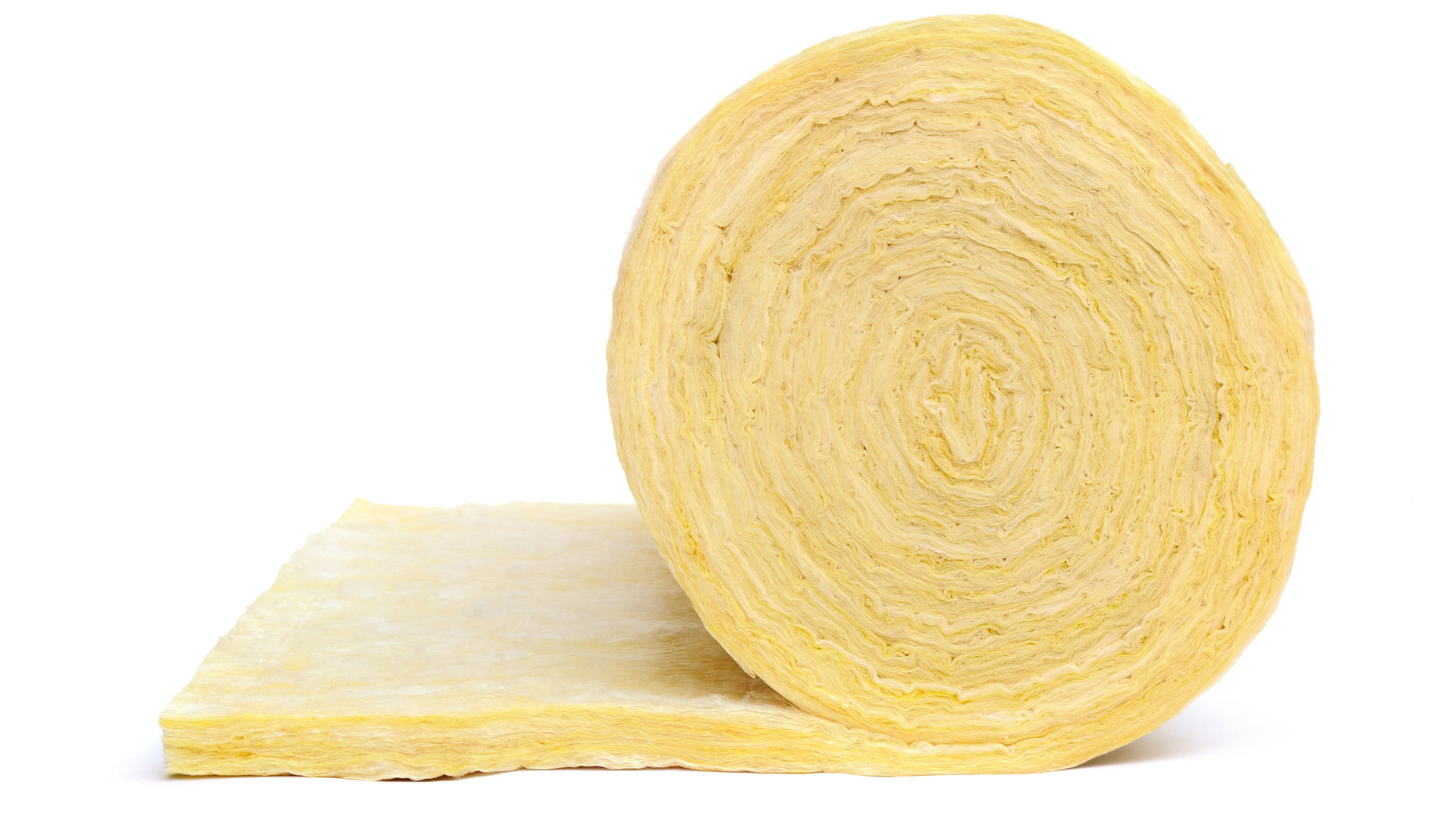 A yellow roll of insulation sits on a white backdrop.