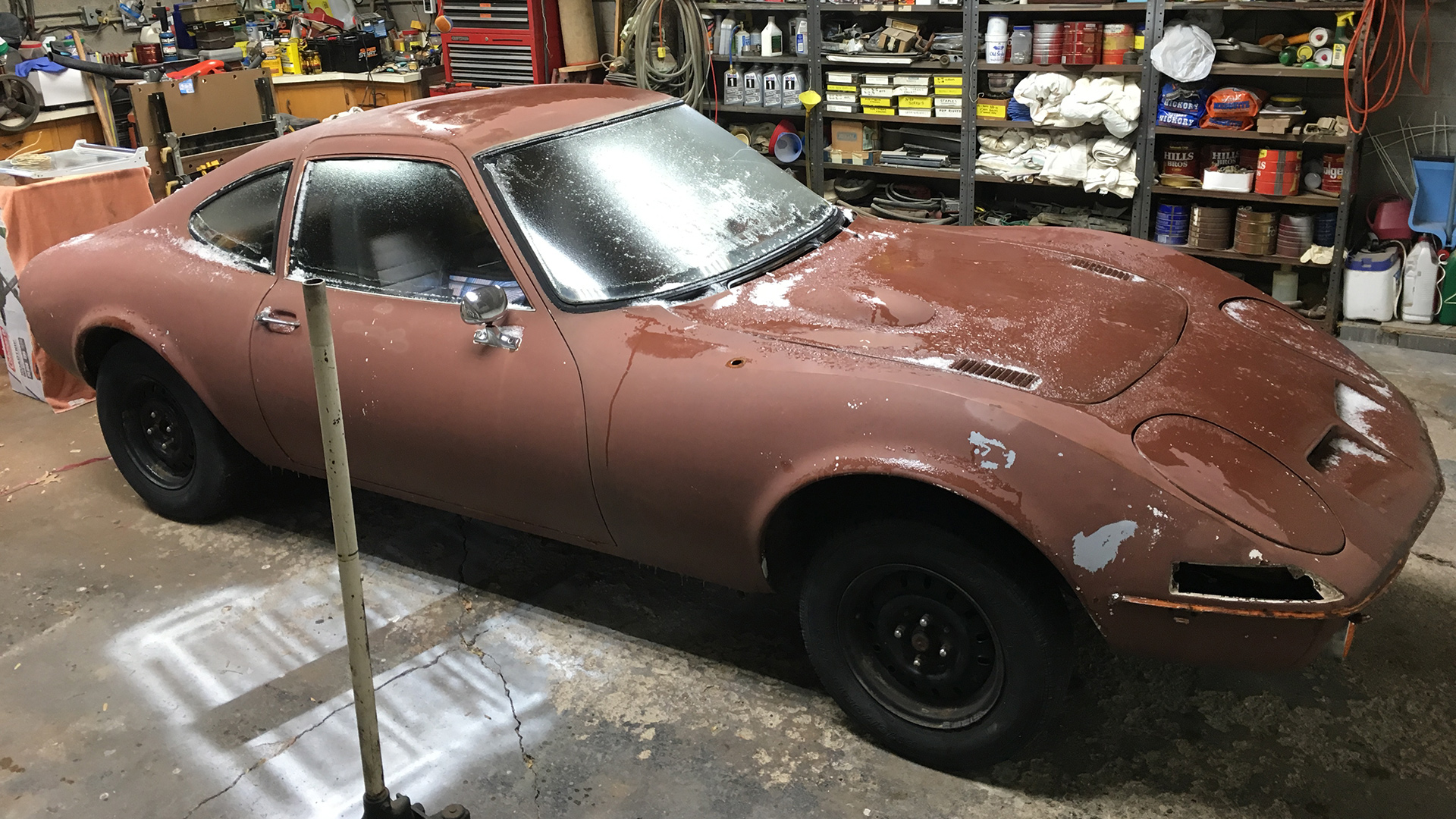 An Opel GT project in a garage.