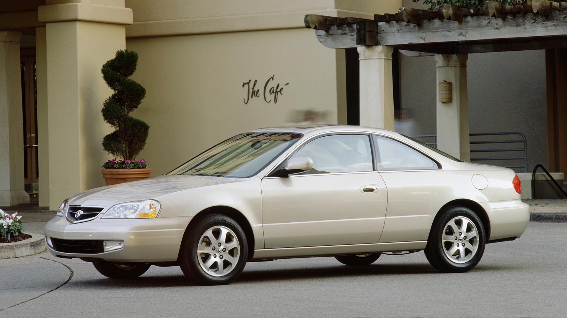 A 2001 Acura 3.2CL Type S parked in front of a cafe.