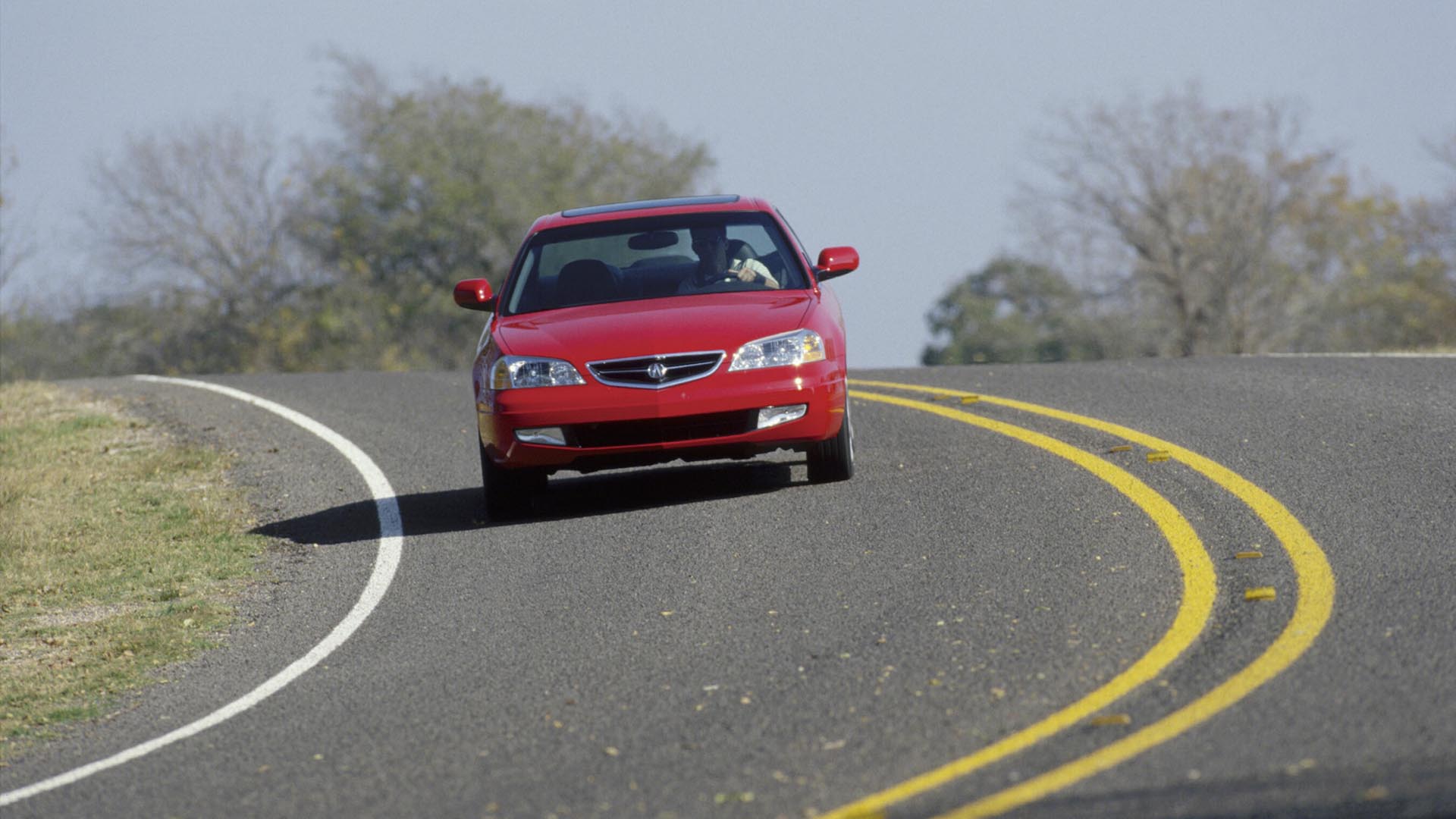 A 2001 Acura 3.2CL Type S driving on a two-lane road.
