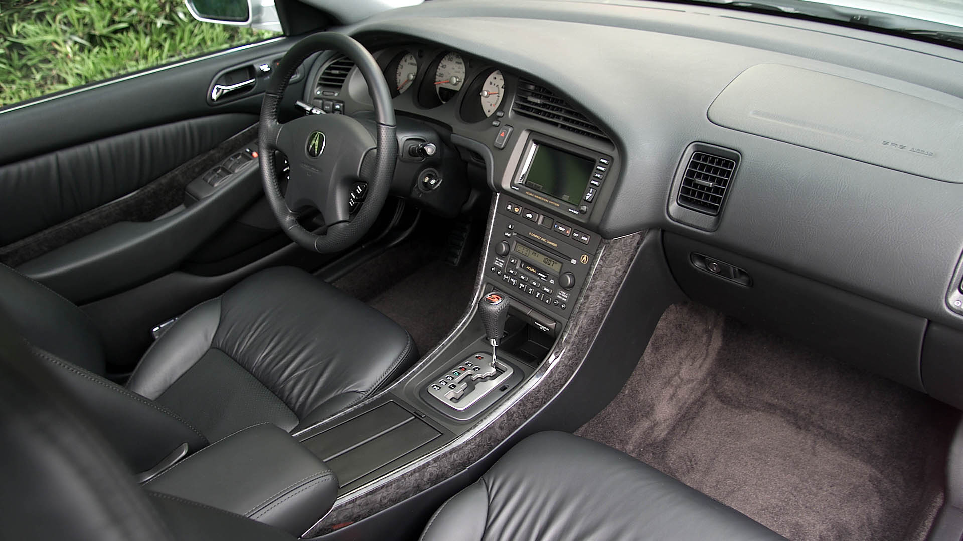 The black interior of a 2002-2003 3.2 TL Type S.