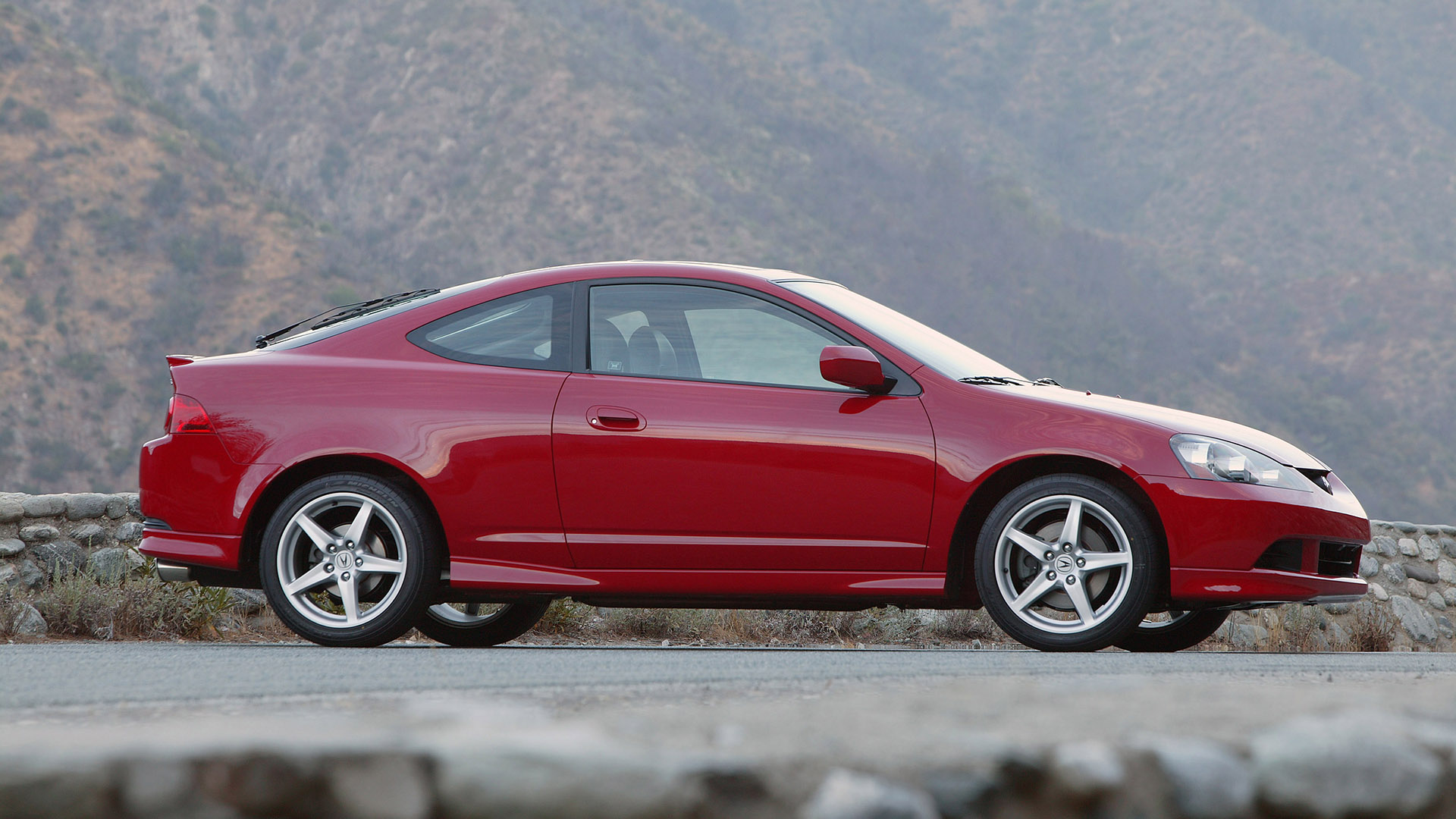 The side view of the 2005-2006 Acura RSX Type S in red.