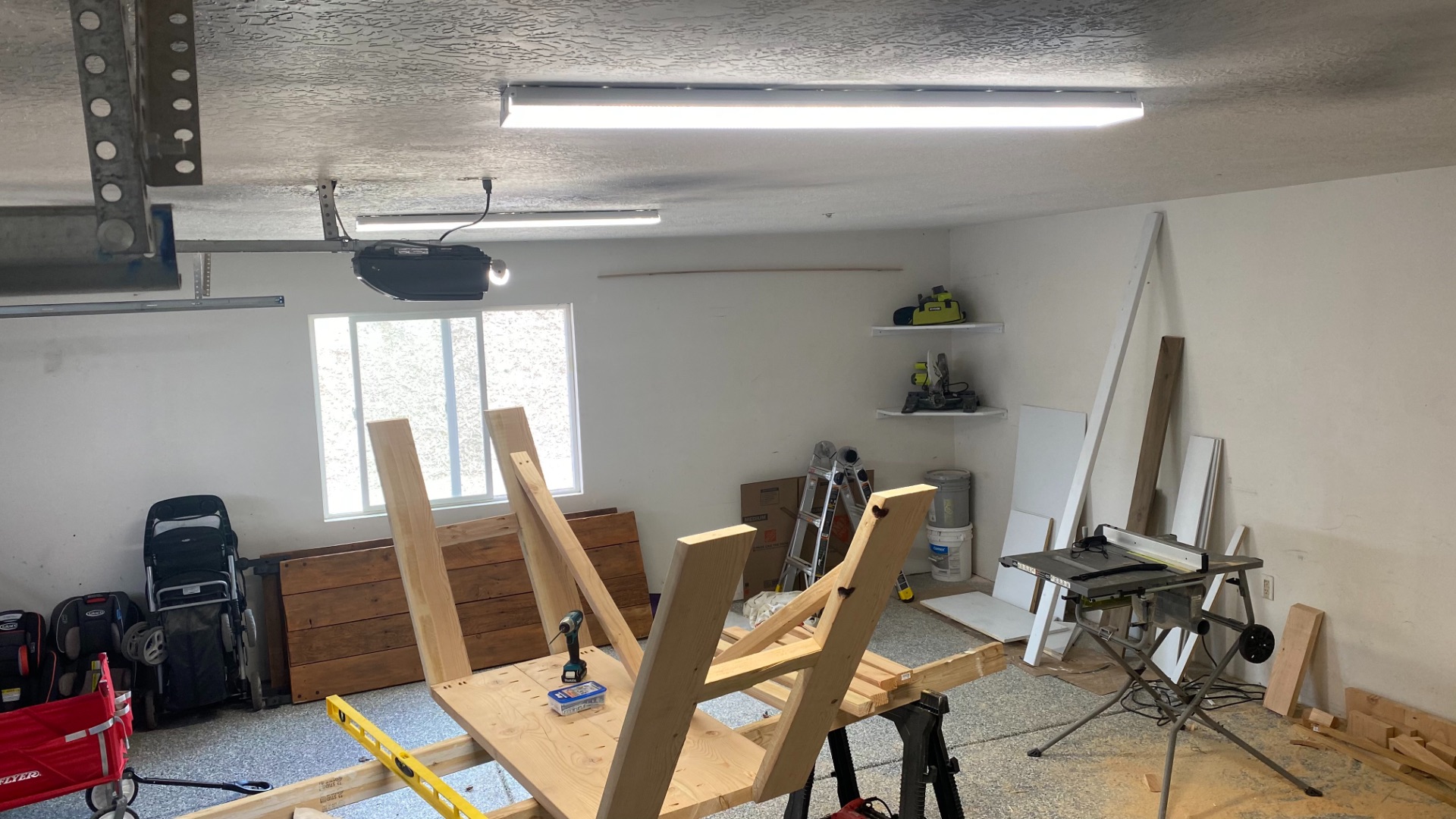 His messy, yet well-lit, garage!