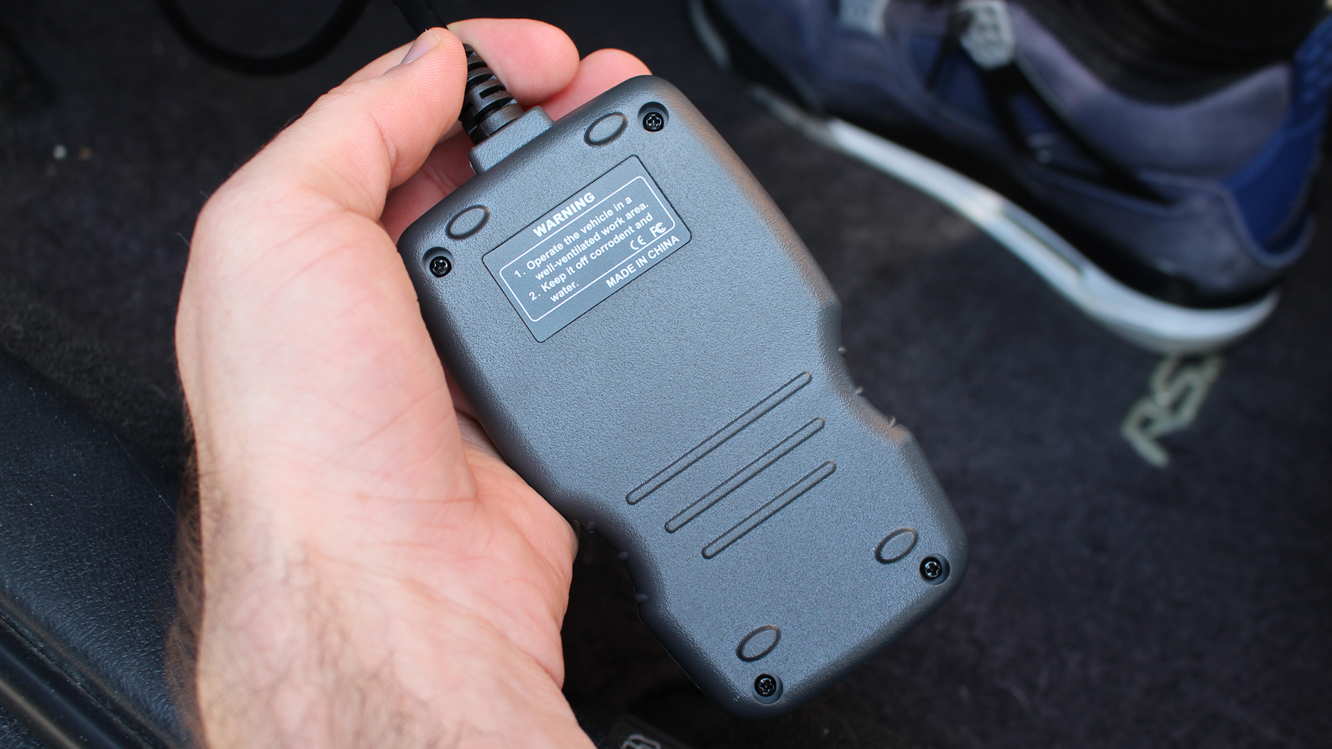 The back of an Ancel AD310 OBD reader.