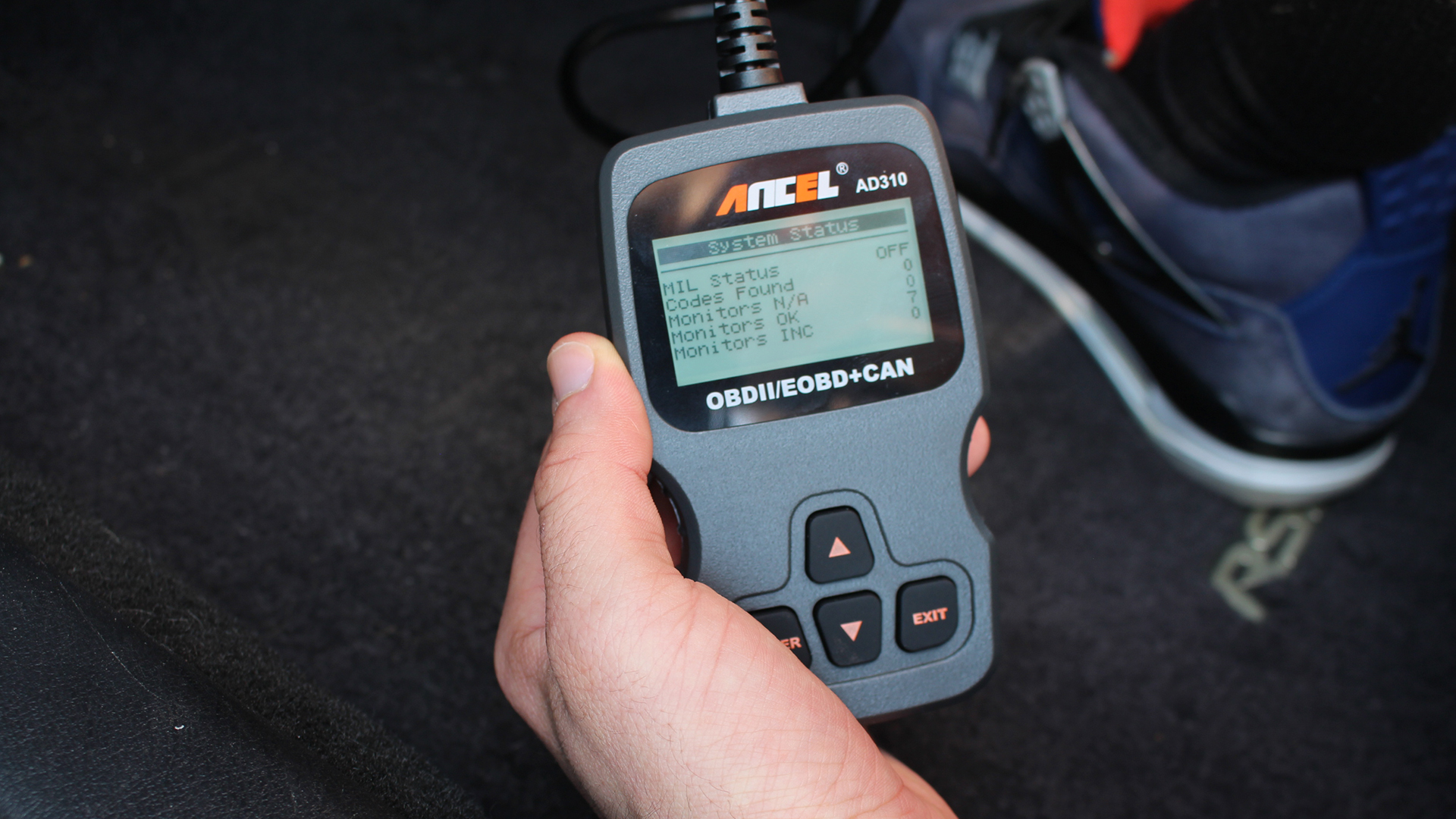The diagnostic menu on an Ancel AD310 OBD reader.