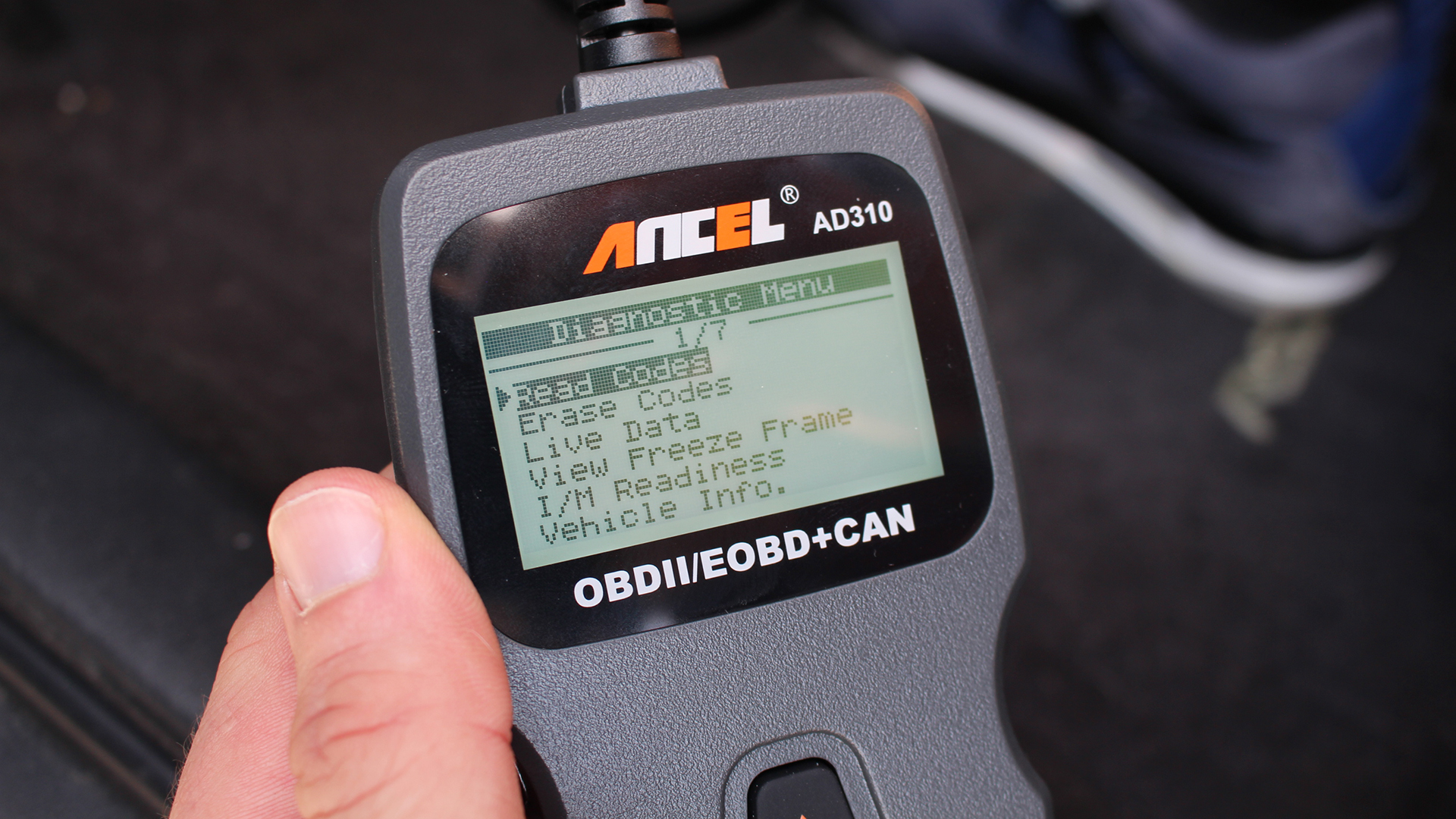 The diagnostic menu on an Ancel AD310 OBD reader.