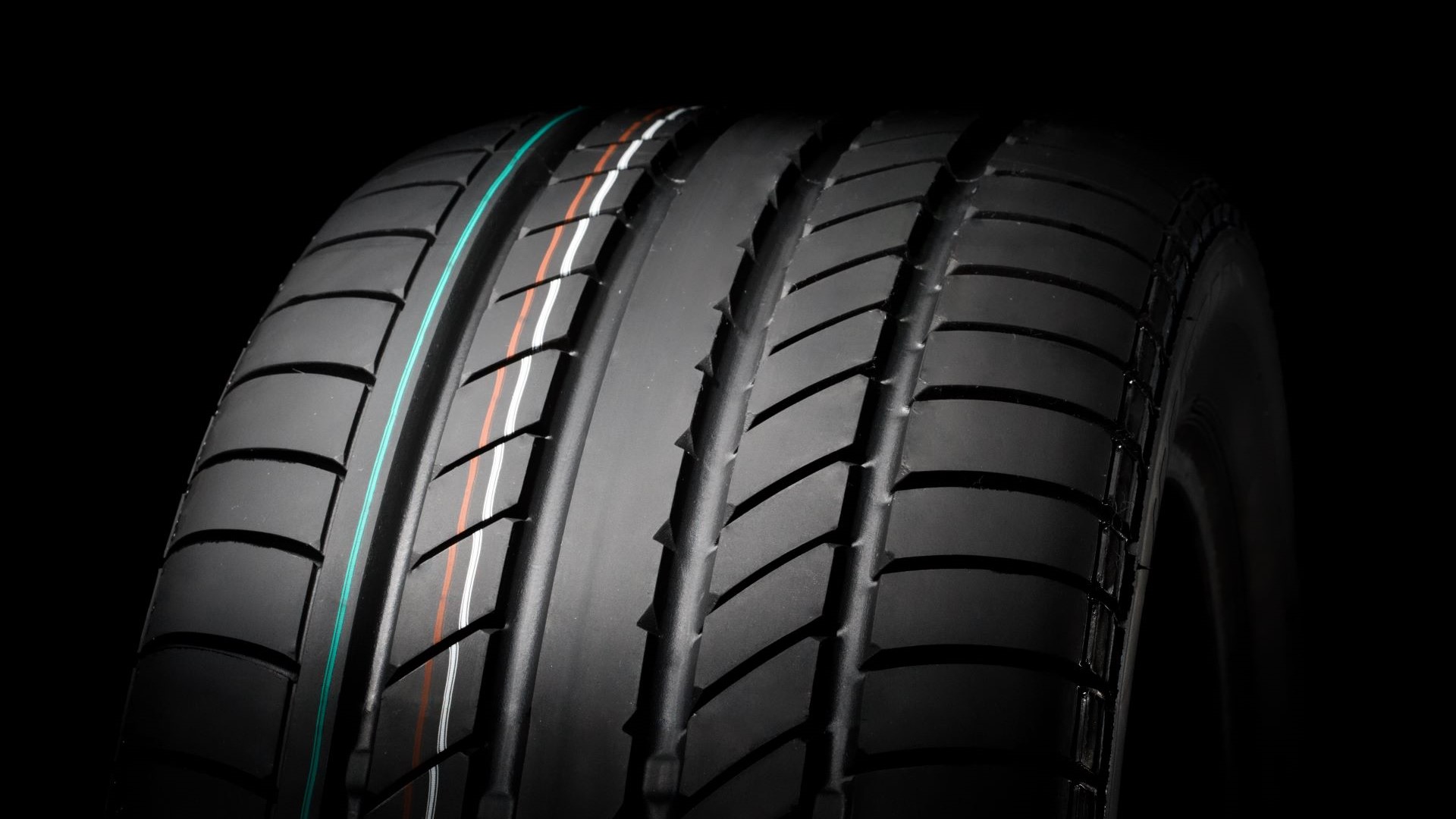 An up-close view of the tread on a summer tire.