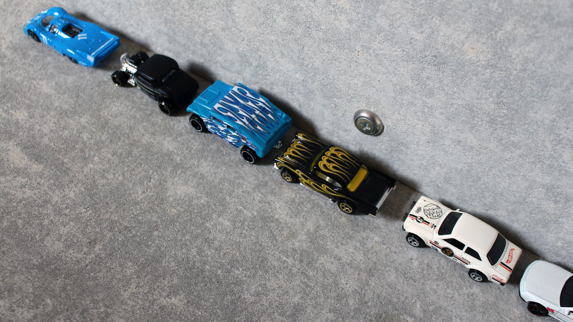 A demonstration of parallel parking using Hot Wheels cars.