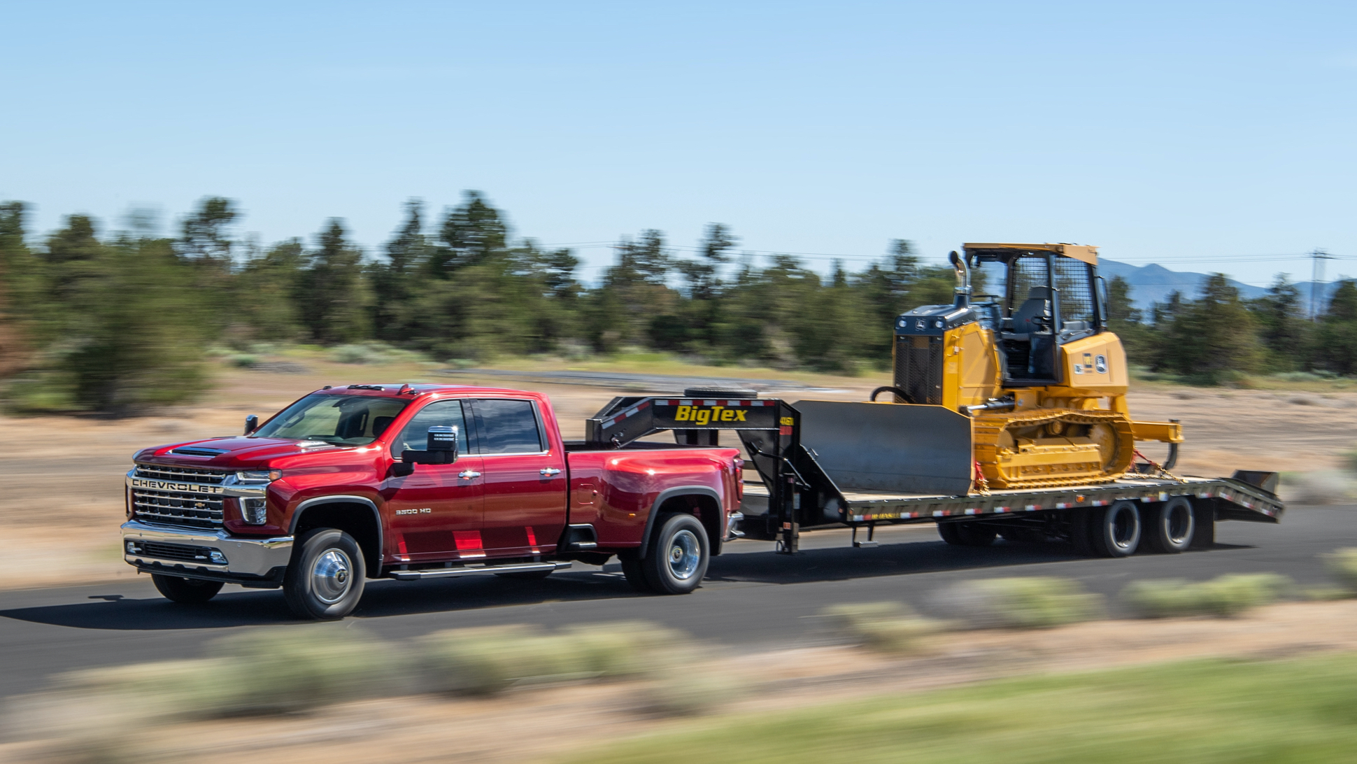 Chevy Silverado 3500 HD towing a John Deere bulldozer