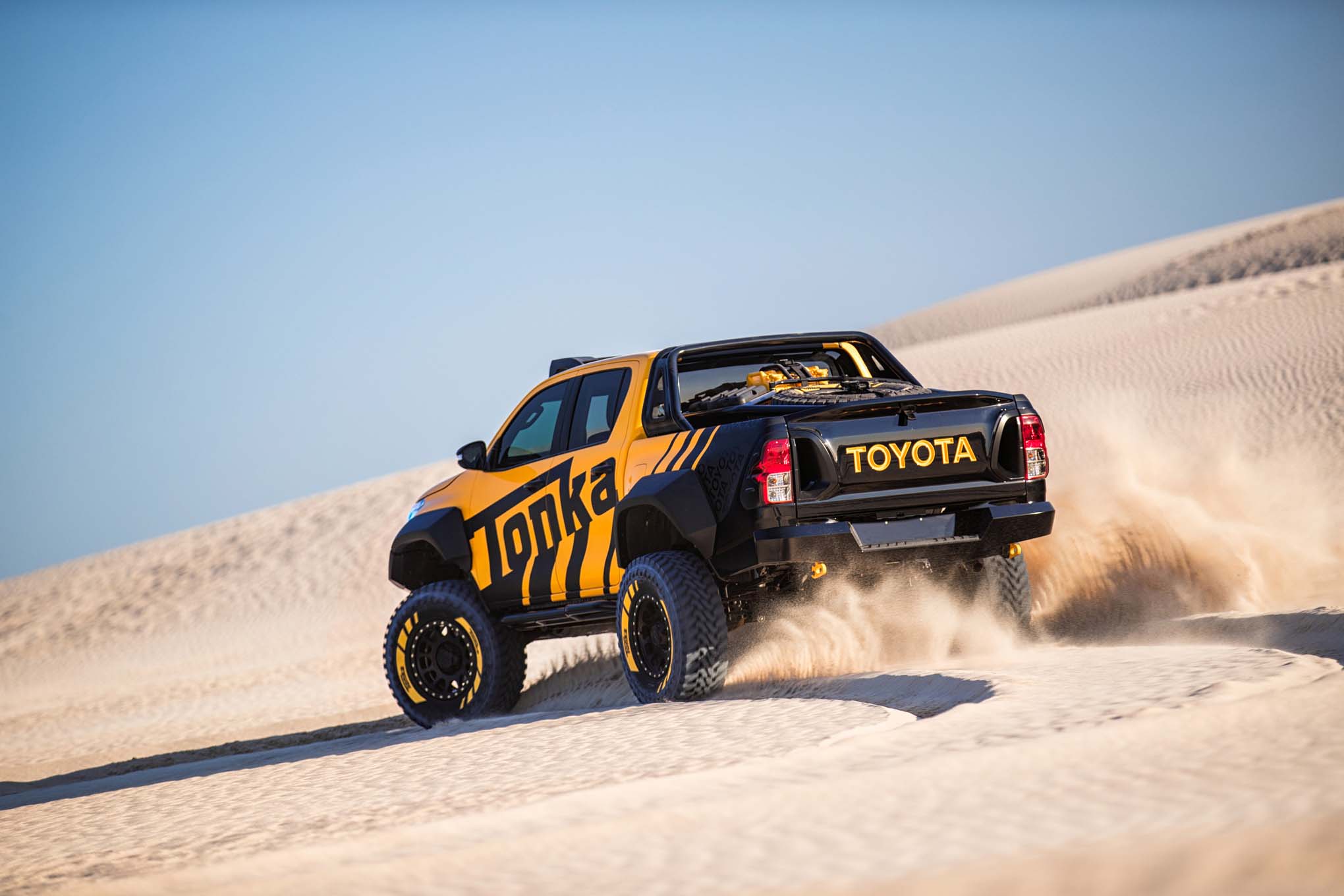 message-editor%2F1490891577895-2017-toyota-hilux-tonka-concept-rear-three-quarter-in-sand.jpg