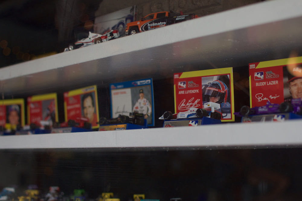 A man's diecast collection is on display for race passersby to witness.